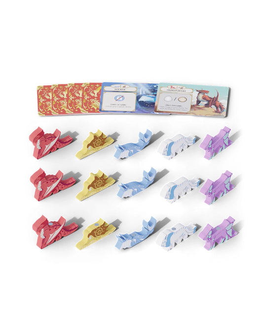 A set of small miniatures for Wondrous Creatures Crew Set Expansion below an instruction booklet on a plain white background. The set includes red, yellow, light blue, white, and purple paper airplanes, with the booklet showing colorful printed instructions.