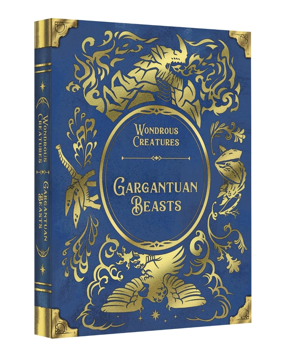 Board game titled 'Gargantuan Beasts' from the 'Wondrous Creatures' series, featuring an ornate gold foil design on a deep blue cover and spine, shown at a three-quarter angle on a white background.