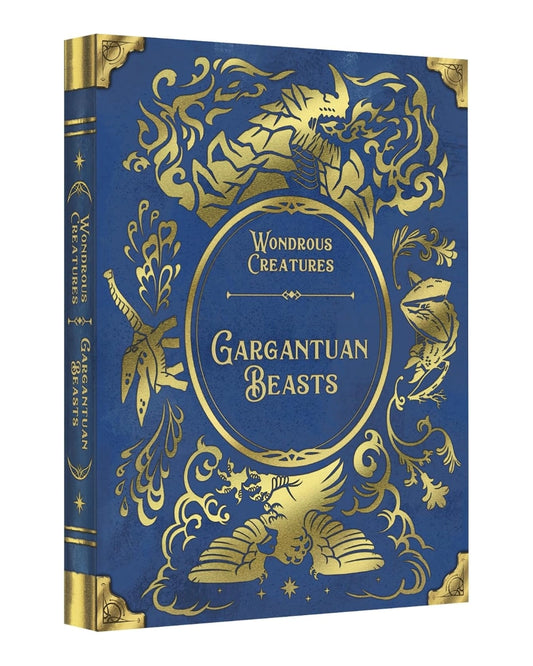Board game titled 'Gargantuan Beasts' from the 'Wondrous Creatures' series, featuring an ornate gold foil design on a deep blue cover and spine, shown at a three-quarter angle on a white background.