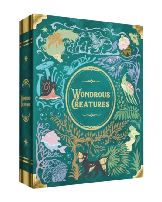 Wondrous Creatures board game is shown at a three-quarter angle, displaying its teal cover decorated with colourful fantasy illustrations and gold accents.