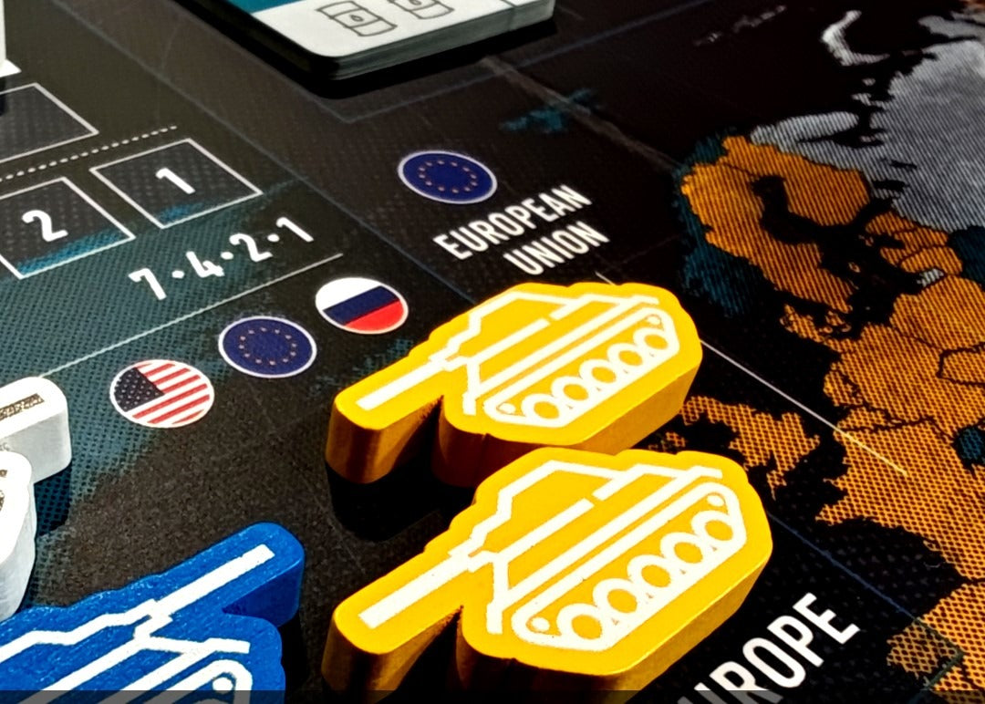 World Order board game box by Hegemonic Project Games Close-up of a roulette table with gaming chips and a smartphone displaying a casino app.